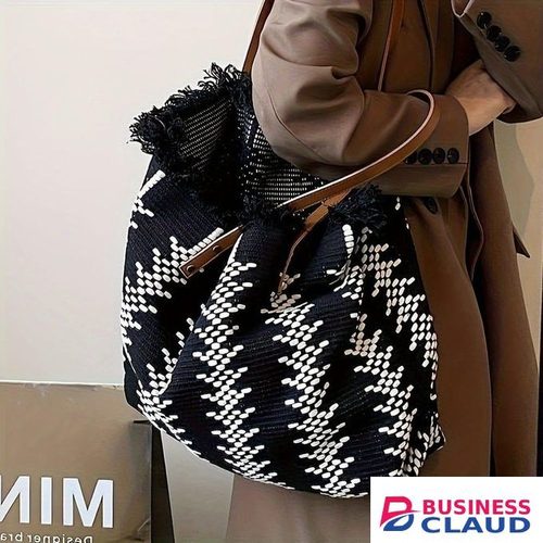 Large woven tote bag with a black and white herringbone pattern