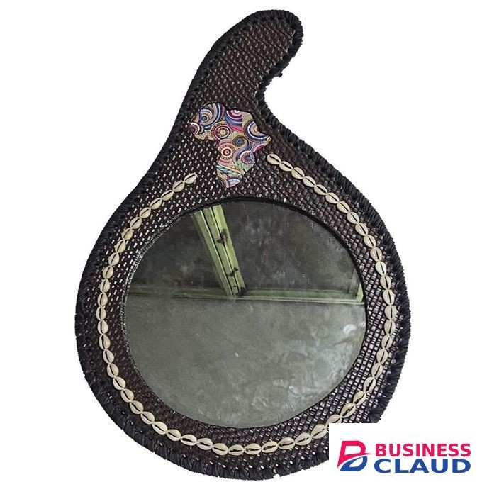 A customized calabash dark brown leather shaped African mirror