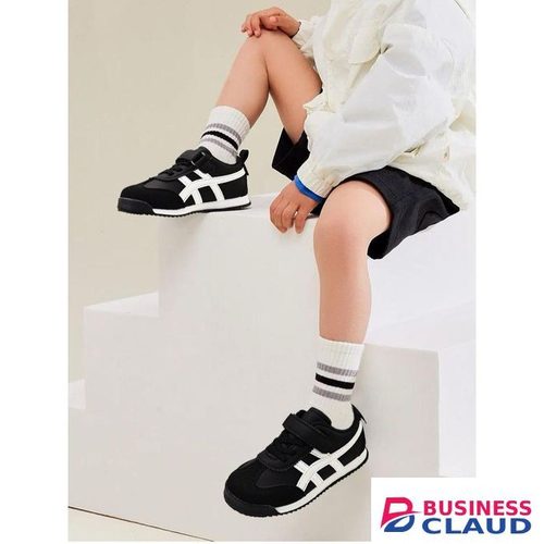 Kids black sneakers with a white stripe