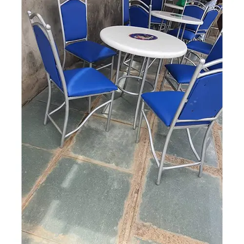 A set of 4 metallic Club chairs and a table